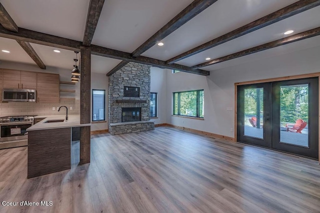 74 Wedge Ct, Priest Lake, ID 83856 - kitchen with appliances with stainless steel finishes, a sink, modern cabinets, open shelves, and light countertops