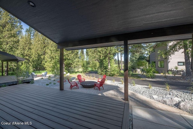 74 Wedge Ct, Priest Lake, ID 83856 - deck with an outdoor fire pit and a patio