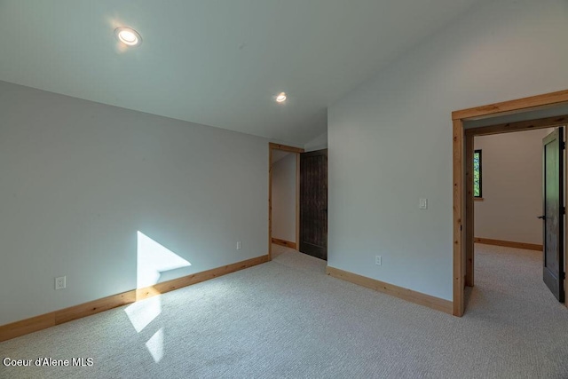 74 Wedge Ct, Priest Lake, ID 83856 - empty room featuring vaulted ceiling, carpet, baseboards, and recessed lighting