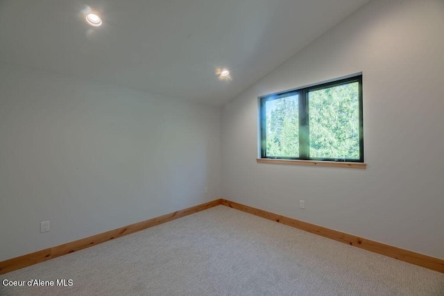 74 Wedge Ct, Priest Lake, ID 83856 - empty room with vaulted ceiling, carpet flooring, baseboards, and recessed lighting
