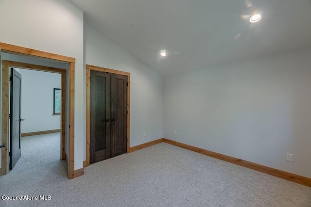 74 Wedge Ct, Priest Lake, ID 83856 - carpeted empty room with vaulted ceiling, baseboards, and recessed lighting