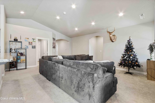 4447 N Connery Loop, Post Falls, ID 83854 - living area featuring arched walkways, light colored carpet, vaulted ceiling, baseboards, and recessed lighting
