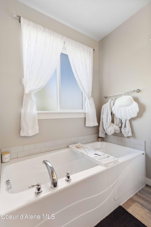 4447 N Connery Loop, Post Falls, ID 83854 - bathroom with a bath and wood finished floors