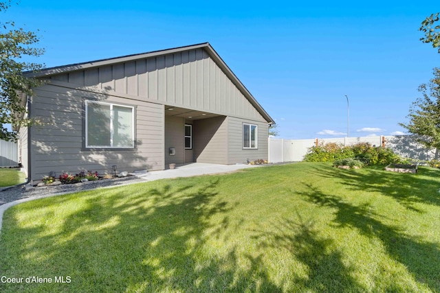 4447 N Connery Loop, Post Falls, ID 83854 - view of front of home with board and batten siding and a patio