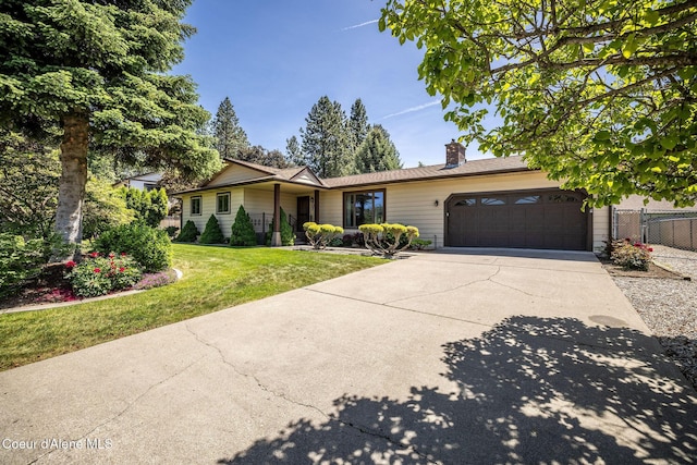 407 W Musket Ave, Post Falls, ID 83854 - ranch-style home with driveway, a garage, and a chimney