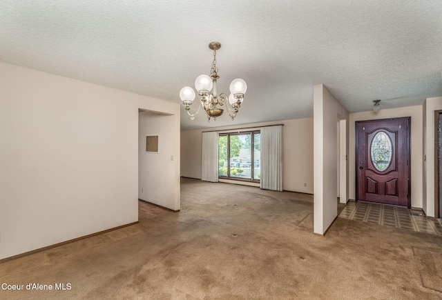 407 W Musket Ave, Post Falls, ID 83854 - carpeted entryway featuring a chandelier