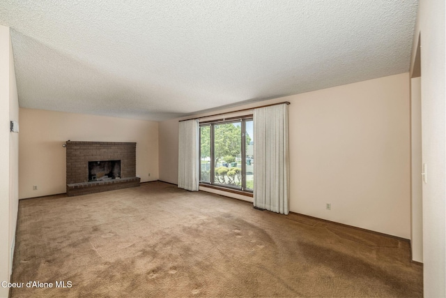 407 W Musket Ave, Post Falls, ID 83854 - unfurnished living room with carpet, a brick fireplace, and a textured ceiling
