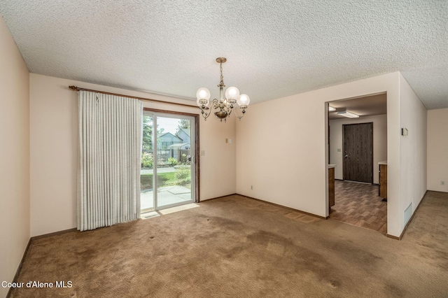 407 W Musket Ave, Post Falls, ID 83854 - carpeted empty room featuring a chandelier and a textured ceiling