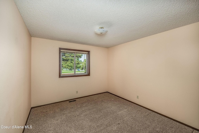 407 W Musket Ave, Post Falls, ID 83854 - empty room featuring carpet floors and a textured ceiling