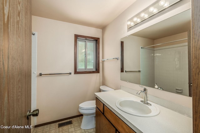 407 W Musket Ave, Post Falls, ID 83854 - bathroom featuring toilet, vanity, a shower, and baseboards