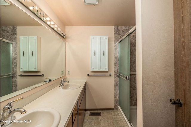407 W Musket Ave, Post Falls, ID 83854 - full bathroom with a shower stall, baseboards, and double vanity
