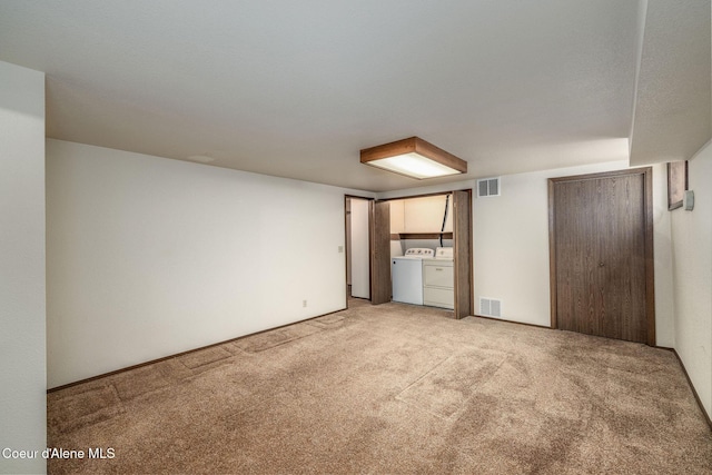 407 W Musket Ave, Post Falls, ID 83854 - unfurnished bedroom featuring separate washer and dryer and light carpet