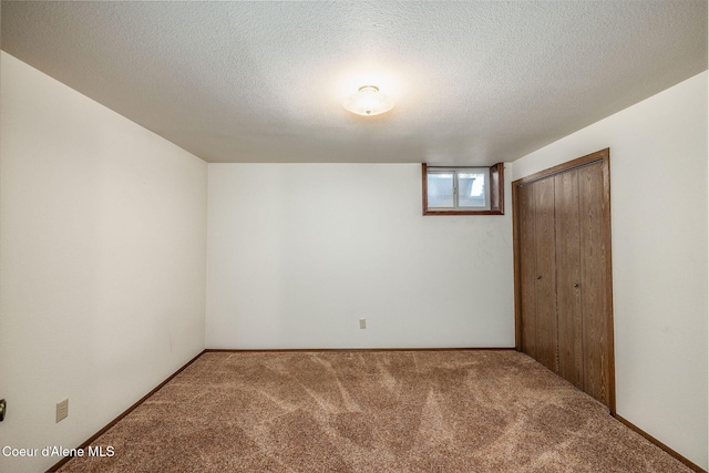 407 W Musket Ave, Post Falls, ID 83854 - unfurnished bedroom with carpet flooring, a closet, and a textured ceiling