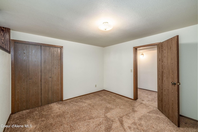 407 W Musket Ave, Post Falls, ID 83854 - unfurnished bedroom with carpet flooring, a closet, and baseboards