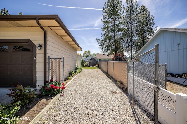 407 W Musket Ave, Post Falls, ID 83854 - view of side of home featuring a garage