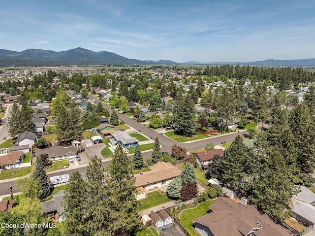 407 W Musket Ave, Post Falls, ID 83854 - aerial overview of property's location with a mountainous background and nearby suburban area