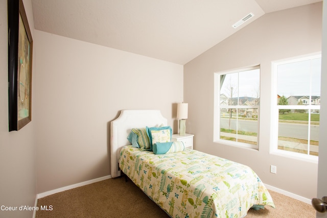 2142 W Cholet Ln, Coeur Dalene, ID 83815 - bedroom featuring carpet flooring, lofted ceiling, and baseboards