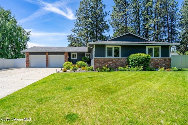 3623 W Hillcrest Cir, Coeur Dalene, ID 83815 - split level home with brick siding, a garage, and concrete driveway