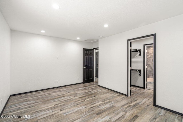 3623 W Hillcrest Cir, Coeur Dalene, ID 83815 - empty room with wood finished floors, recessed lighting, and baseboards