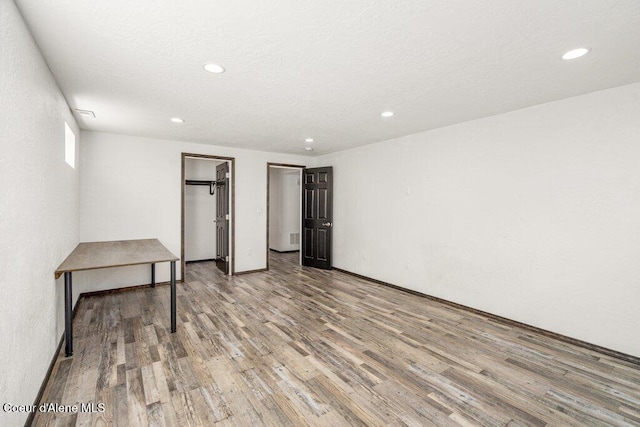 3623 W Hillcrest Cir, Coeur Dalene, ID 83815 - unfurnished bedroom featuring wood finished floors and recessed lighting