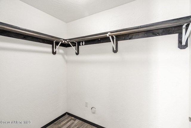 3623 W Hillcrest Cir, Coeur Dalene, ID 83815 - spacious closet featuring dark wood-type flooring