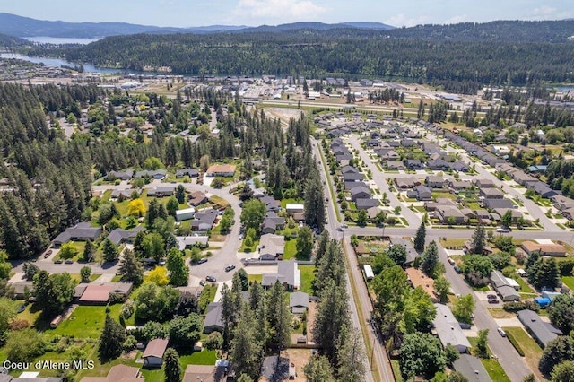 3623 W Hillcrest Cir, Coeur Dalene, ID 83815 - aerial view of property's location with a forest, nearby suburban area, and a water and mountain view