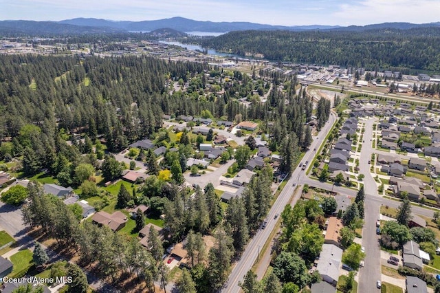 3623 W Hillcrest Cir, Coeur Dalene, ID 83815 - view of property location featuring a heavily wooded area, a mountain backdrop, and nearby suburban area