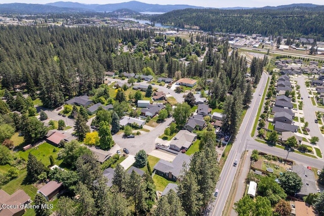 3623 W Hillcrest Cir, Coeur Dalene, ID 83815 - view of property location with a forest, a mountain backdrop, and nearby suburban area