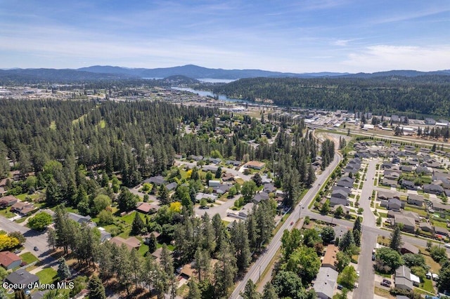 3623 W Hillcrest Cir, Coeur Dalene, ID 83815 - view of property location featuring a mountain backdrop, a forest, and nearby suburban area