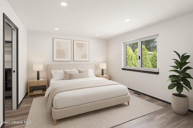 3623 W Hillcrest Cir, Coeur Dalene, ID 83815 - bedroom featuring light wood-type flooring and recessed lighting