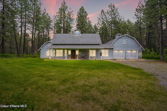 29808 N Caribou Ave, Athol, ID 83801 - view of front of house with covered porch, gravel driveway, a front yard, and a shingled roof
