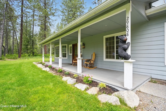 29808 N Caribou Ave, Athol, ID 83801 - view of home's exterior with covered porch and a lawn
