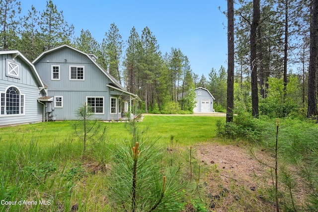 29808 N Caribou Ave, Athol, ID 83801 - view of green lawn with an outdoor structure and a garage