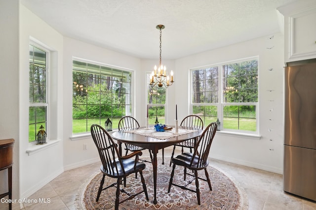 29808 N Caribou Ave, Athol, ID 83801 - dining area with a chandelier and light tile patterned floors