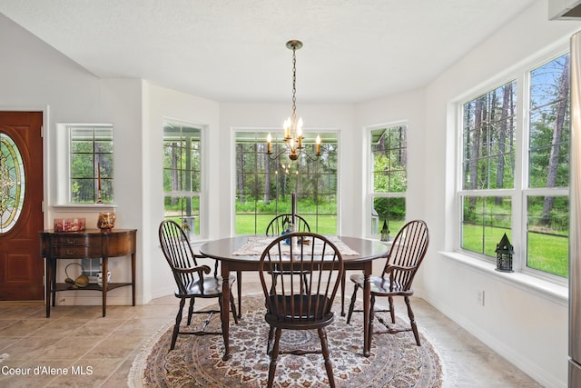 29808 N Caribou Ave, Athol, ID 83801 - dining room with a chandelier and plenty of natural light