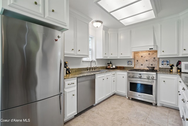29808 N Caribou Ave, Athol, ID 83801 - kitchen with appliances with stainless steel finishes, premium range hood, white cabinetry, and dark stone countertops