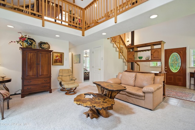 29808 N Caribou Ave, Athol, ID 83801 - carpeted living area featuring a high ceiling, stairway, recessed lighting, and a chandelier