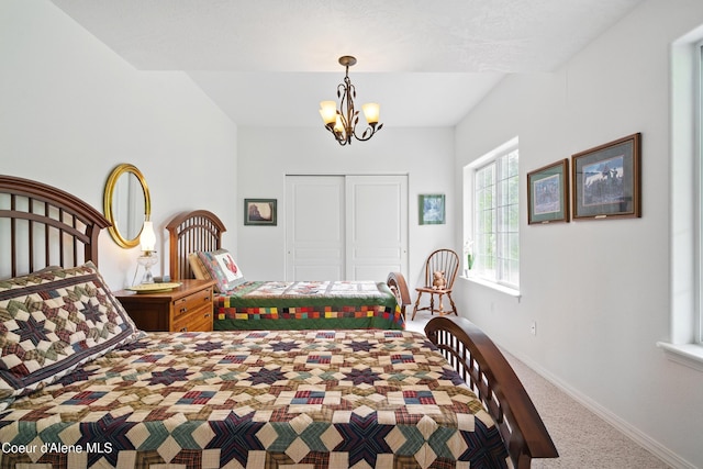 29808 N Caribou Ave, Athol, ID 83801 - bedroom featuring carpet flooring, a closet, and a chandelier