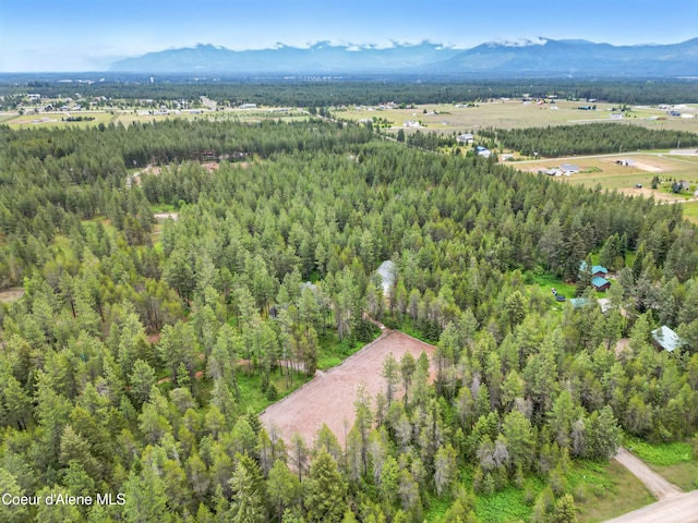 29808 N Caribou Ave, Athol, ID 83801 - aerial view of property and surrounding area with a mountainous background and a heavily wooded area