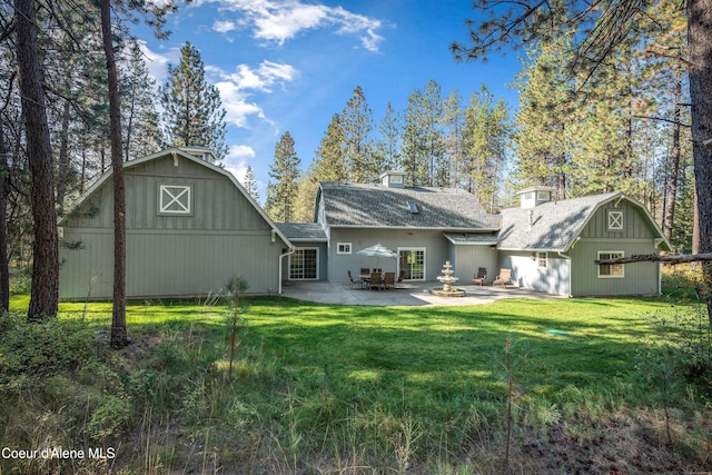 29808 N Caribou Ave, Athol, ID 83801 - back of property featuring a barn, a yard, a shingled roof, and an outdoor structure