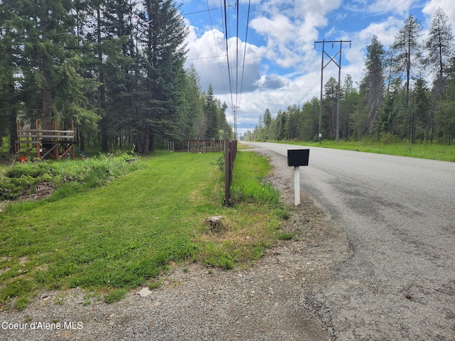 16488 N Atlas Rd, Rathdrum, ID 83858 - view of asphalt street featuring a view of trees