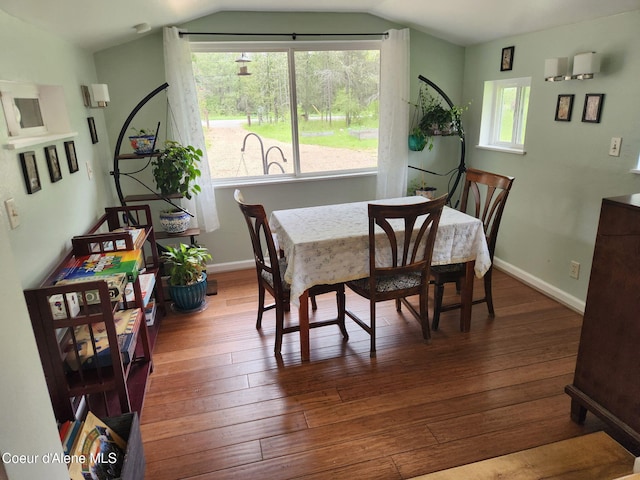 16488 N Atlas Rd, Rathdrum, ID 83858 - dining room featuring wood-type flooring, lofted ceiling, and baseboards