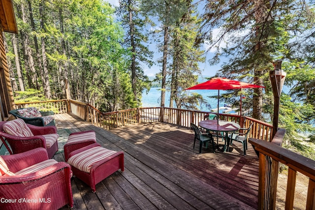 90 Bartoo Is Shr, Priest Lake, ID 83856 - wooden deck featuring outdoor dining area and a water view