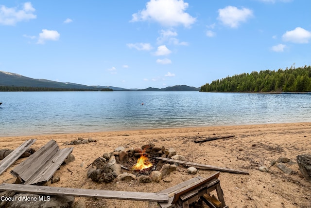 90 Bartoo Is Shr, Priest Lake, ID 83856 - water view featuring an outdoor fire pit and a mountainous background