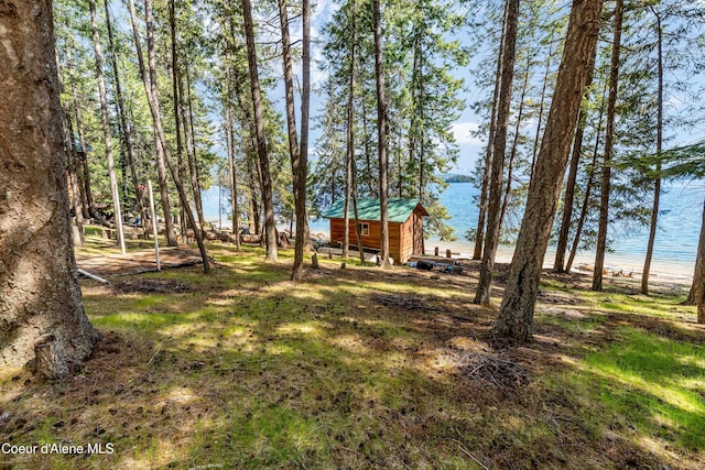 90 Bartoo Is Shr, Priest Lake, ID 83856 - view of yard with an outbuilding and a water view