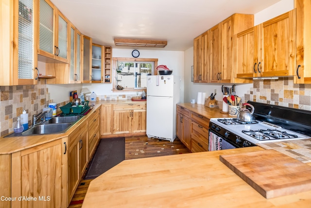 90 Bartoo Is Shr, Priest Lake, ID 83856 - kitchen with freestanding refrigerator, range with gas cooktop, butcher block countertops, a sink, and decorative backsplash