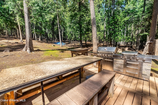 90 Bartoo Is Shr, Priest Lake, ID 83856 - wooden deck featuring outdoor dining area