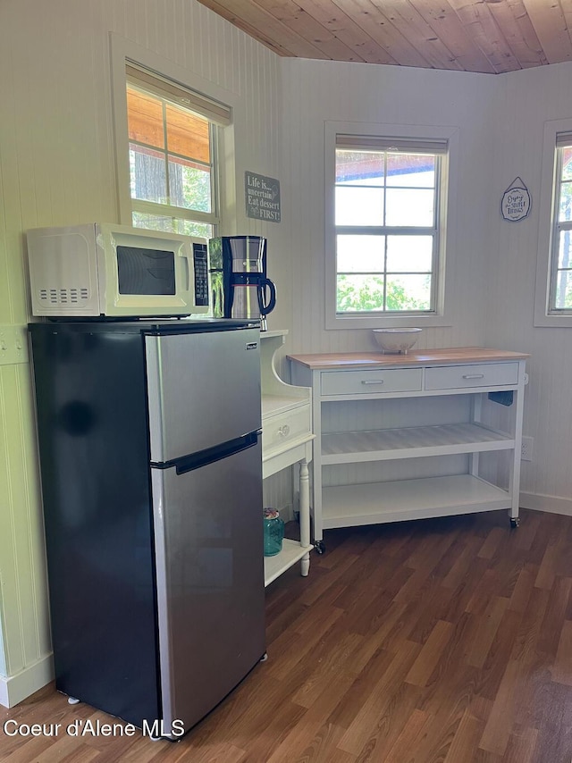 191 Sunset View Ln, Hope, ID 83836 - kitchen featuring freestanding refrigerator, dark wood finished floors, white microwave, and wood ceiling