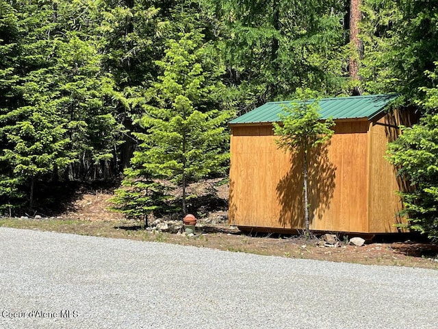 191 Sunset View Ln, Hope, ID 83836 - view of shed featuring a forest view