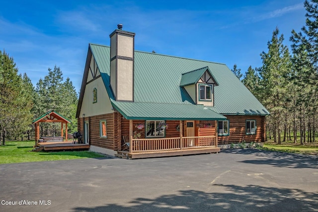 27294 N Clagstone Rd, Athol, ID 83801 - view of front of house with log siding, a chimney, and metal roof